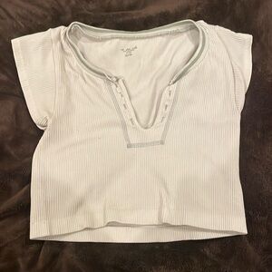 TRENDY- Urban Outfitters out from under cropped t-shirt